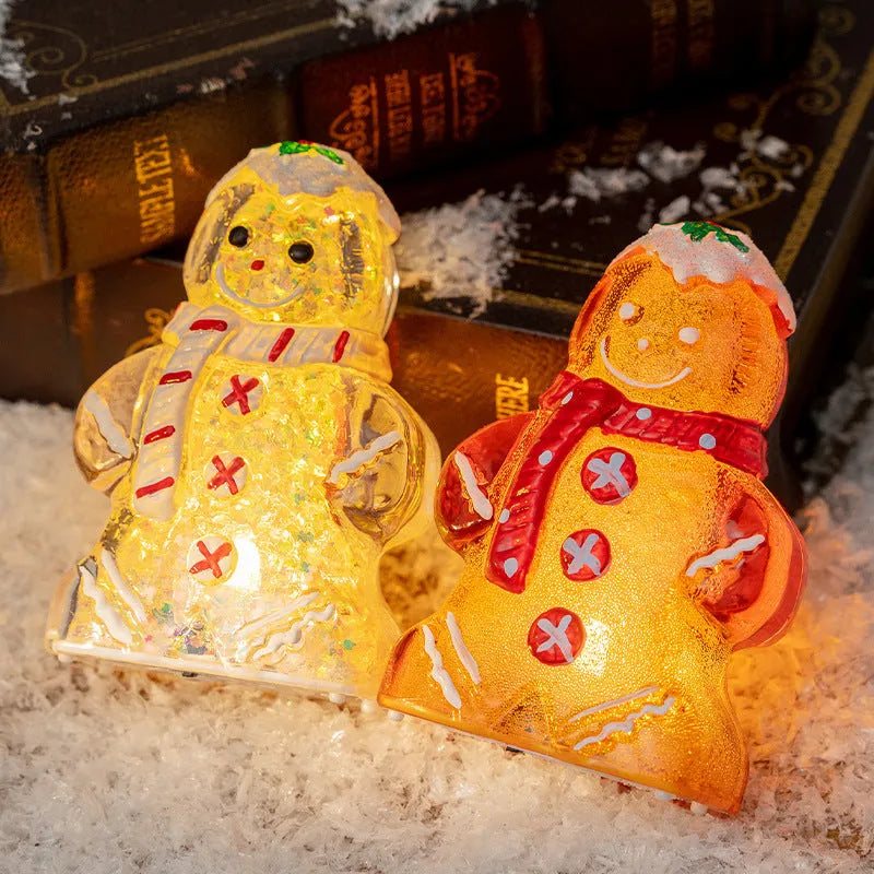 Glowing Christmas gingerbread man snowman ornament in plastic with four colour variations including clear, white and red scarf options
