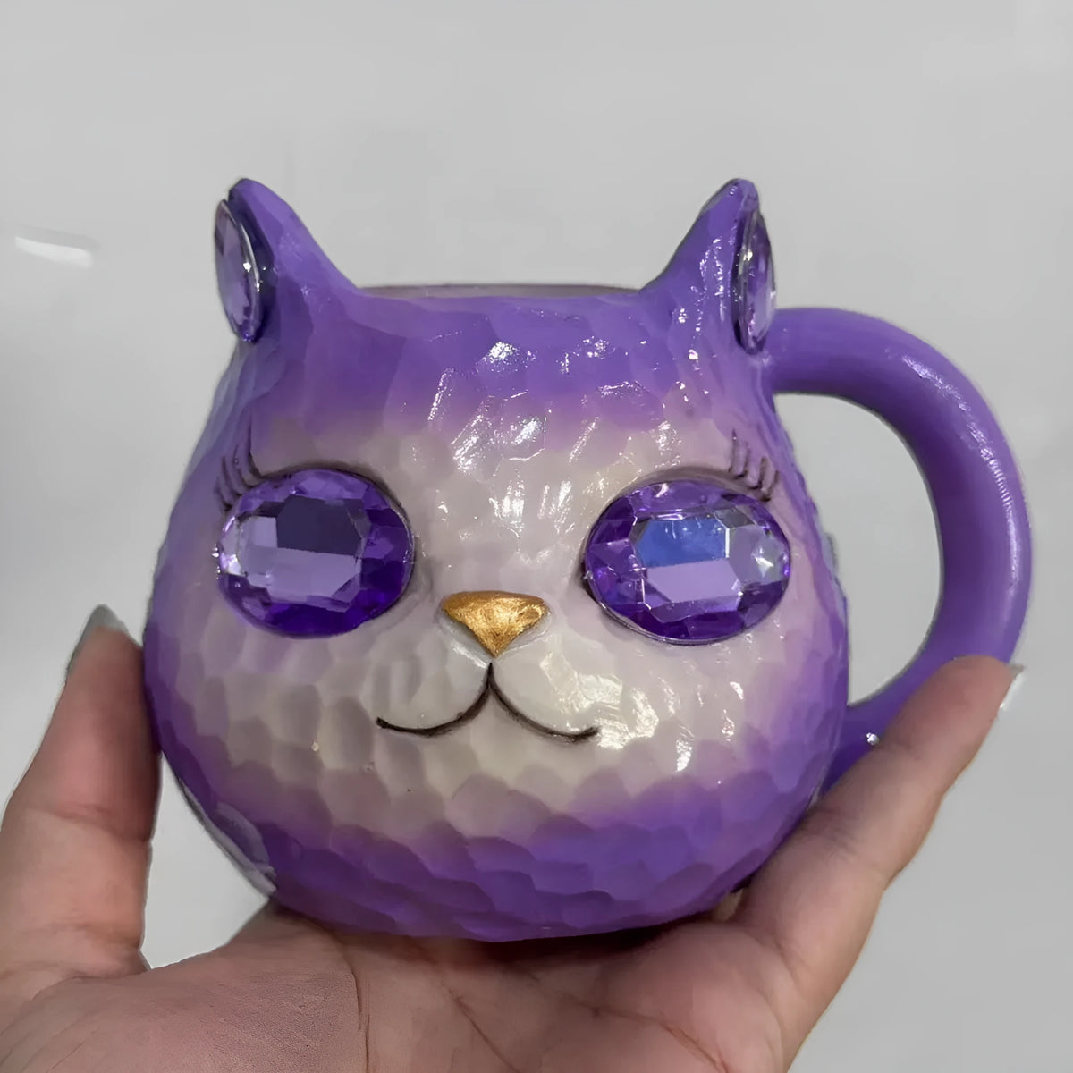 American style resin cat cup decorative figurine in purple, green, blue, or pink.