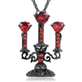 Zinc alloy gothic necklace with hollow candlestick pendant and cross chain on a dark background.