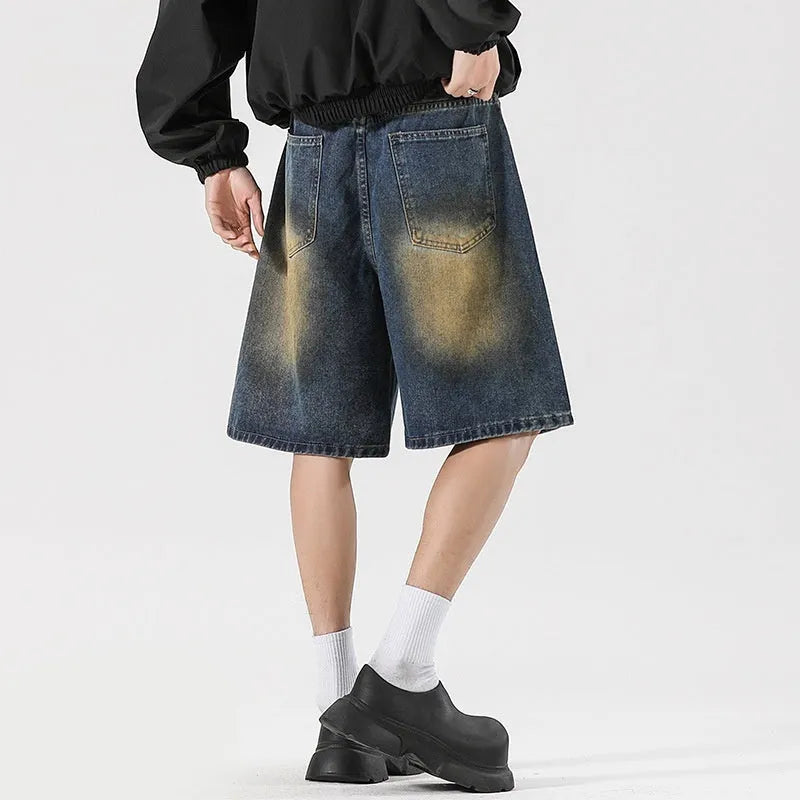 Retro blue loose fit ripped jeans with distressed detailing on denim fabric