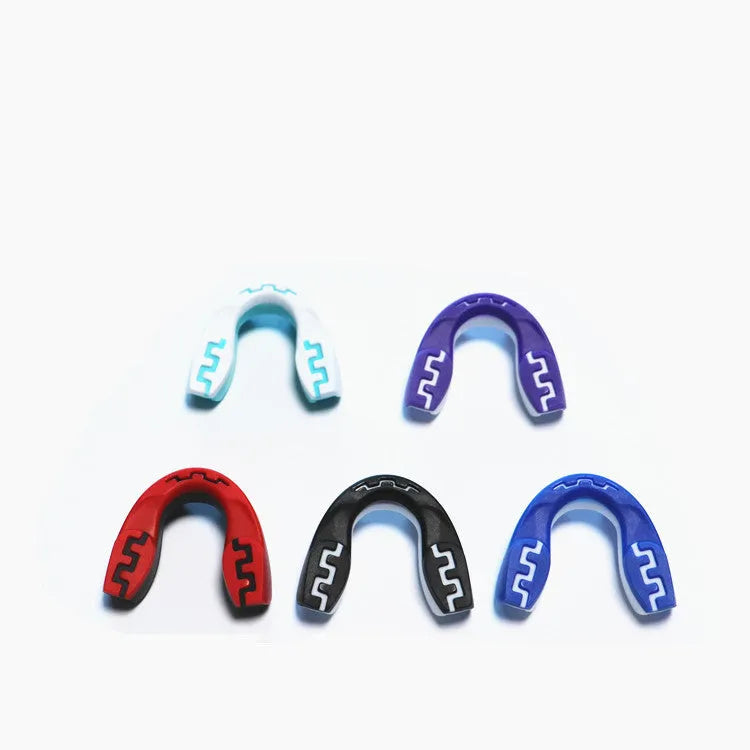 Adult boxing mouthguard with printed tooth design in black and white, for martial arts and fight sports.