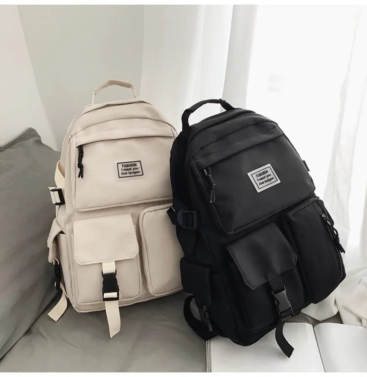 Soft nylon student backpack in black with laptop compartment and three-dimensional pocket