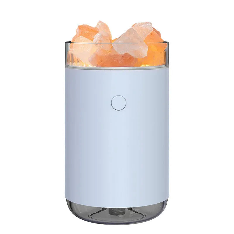 Ultrasonic aromatherapy diffuser humidifier with natural crystal salt stone and LED lamp in blue, showing mist and light