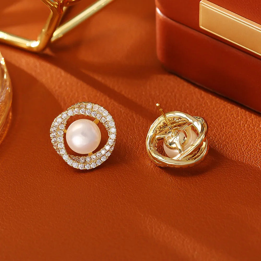 Natural pearl winding ear studs with real gold plating on copper base geometric round design