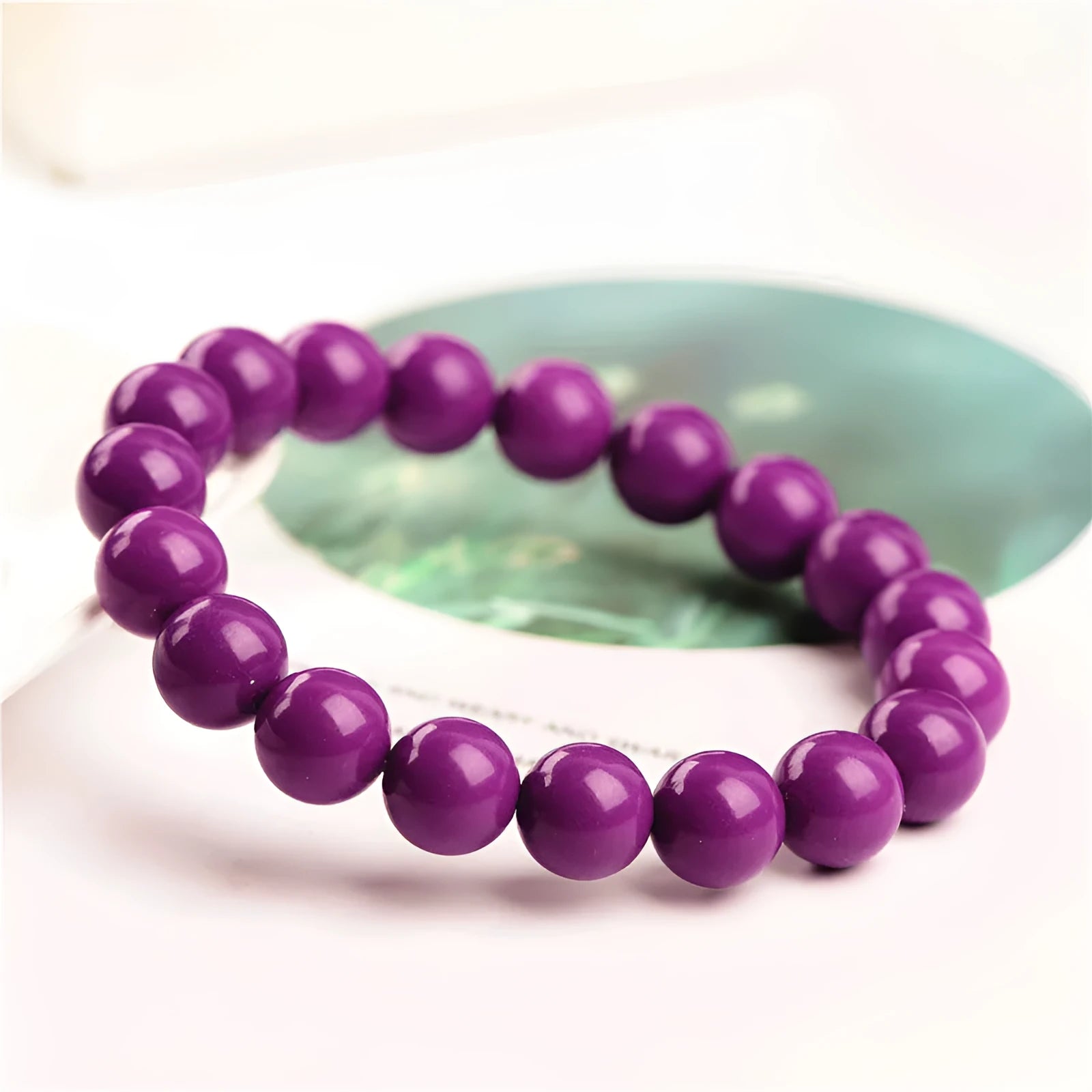 Jiuya polished purple mica crystal bracelet showing single circle beads, available in three size choices.