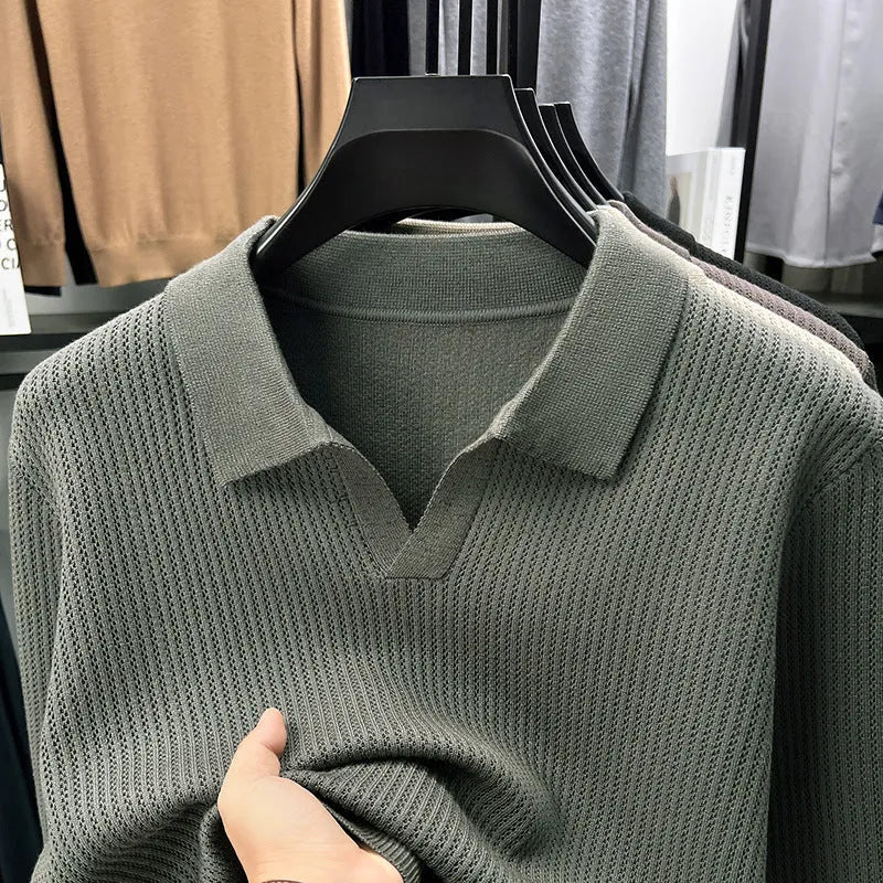 Man wearing a loose green casual pullover sweater, showcasing its autumn leisure style.