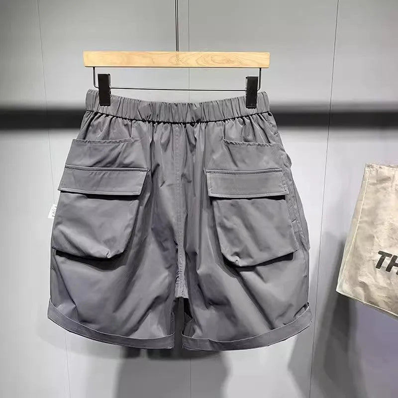Men's black workwear shorts with pockets, loose fit, and straight leg hem