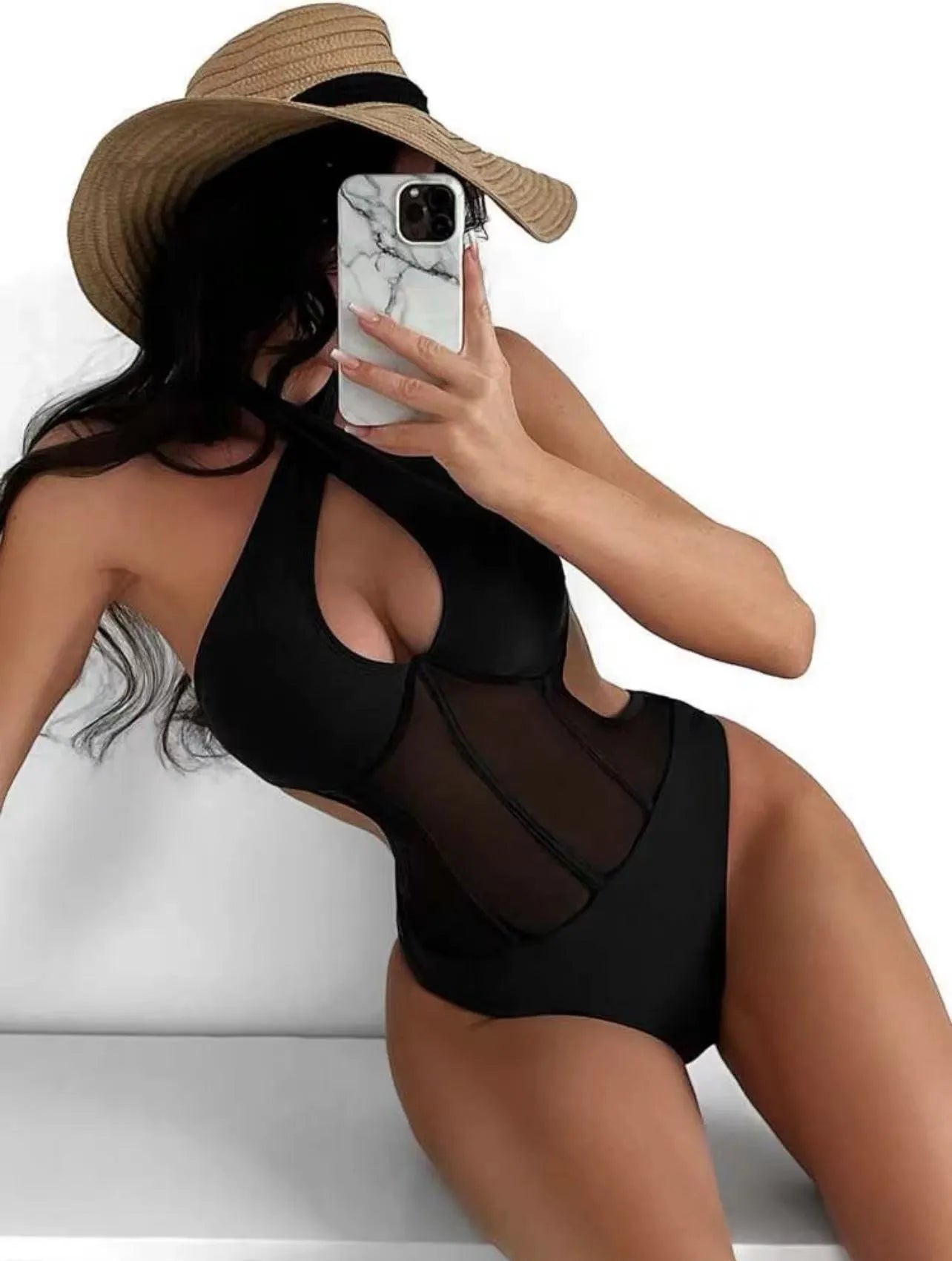 A woman's one-piece bikini swimsuit on a hanger, shown in black, rose red, and green colour options.