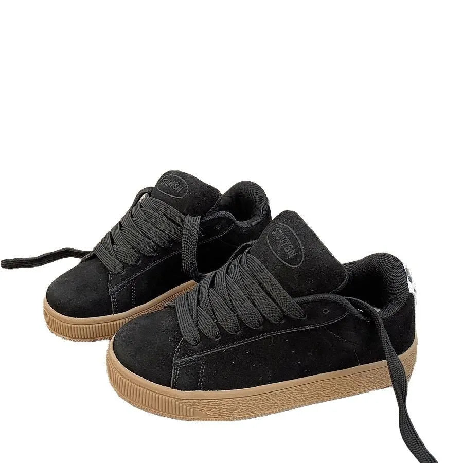 Black retro low-top sneakers with lace-up front, waterproof platform, and round toe design