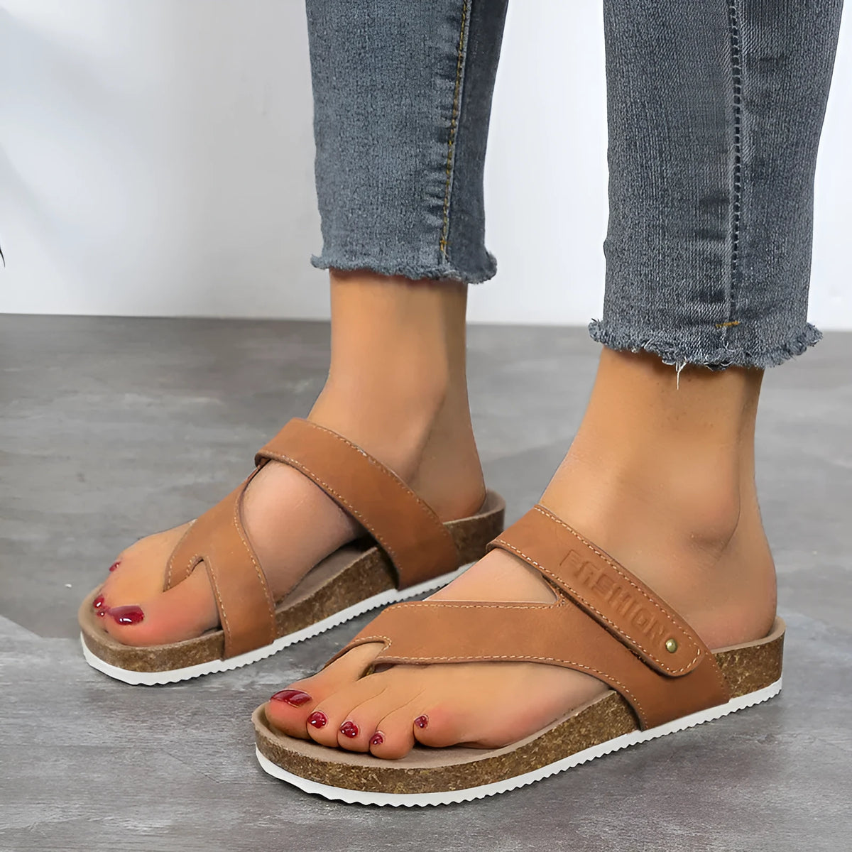 A pair of solid-colour flip-flops with a flat toe ring and thick foam sole.