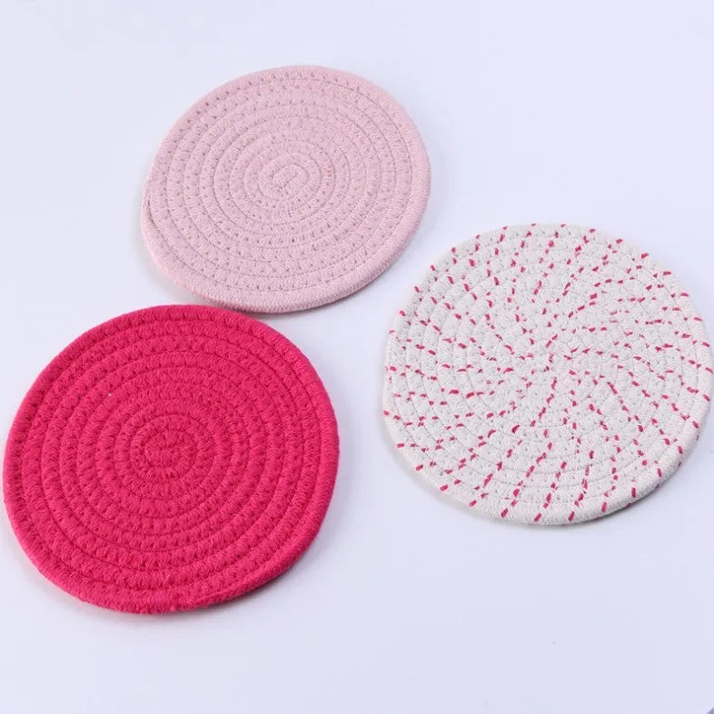 Three round cotton cord coasters in blue colour showing 18cm diameter measurement