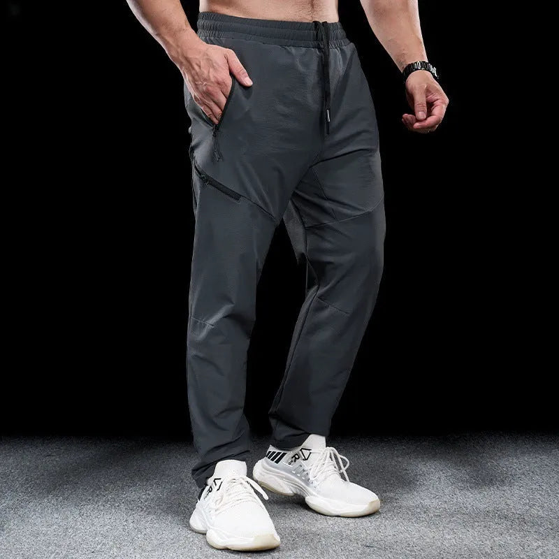 Men's waterproof quick-drying nylon workout pants in multiple colours for sports fitness