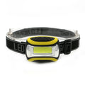 Yellow three-speed COB LED headlamp with adjustable head strap on a black background.