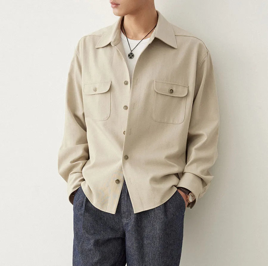 Men's light sand rice coloured lapel shirt with long sleeves on a hanger