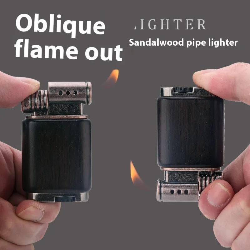 Black wood finished ebony gas lighter with rosewood decorative patterns including sun face and good luck symbols