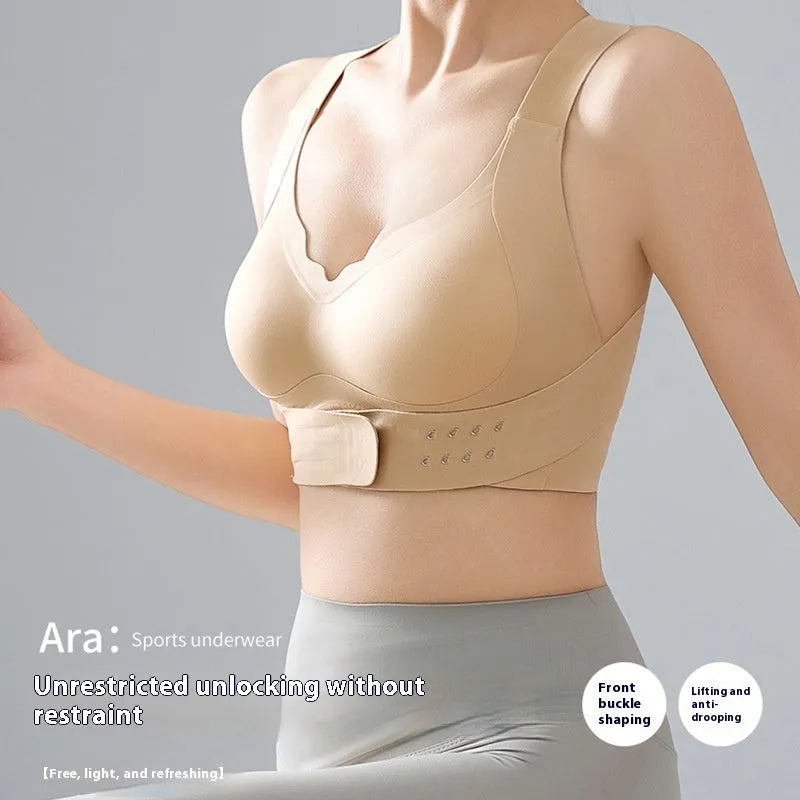Women's black sports bra with front buckle closure and back shaping design for yoga and exercise.