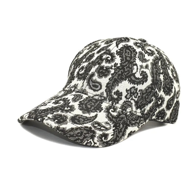 Polyester baseball cap with printed paisley pattern in blue, showing dome crown construction