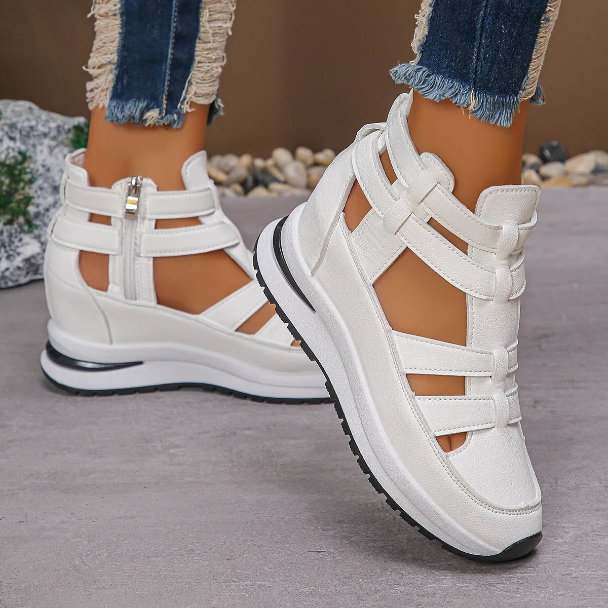 Black women's platform sandals with close toe, hollow-out sides, and a Velcro strap.