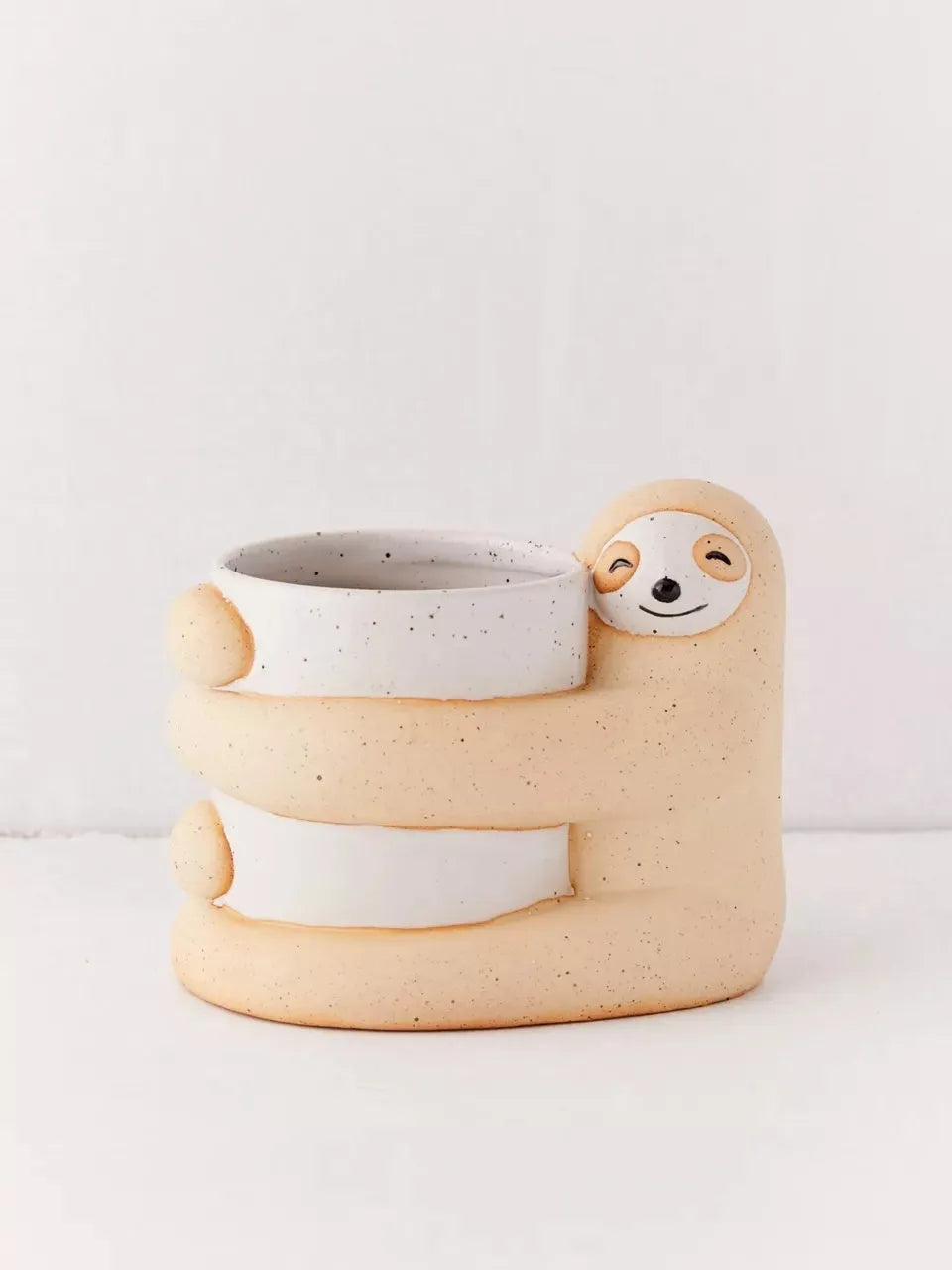 Green ceramic sloth plant pot medium size 9cm diameter on white background