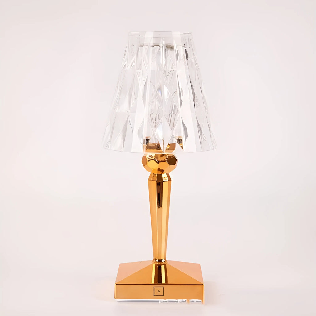 Rose gold portable touch control night light on a table.