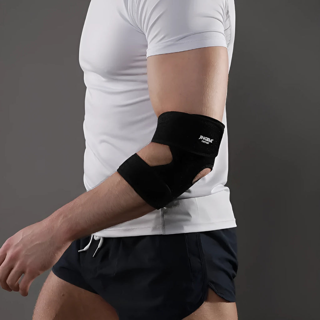 Black adjustable sports elbow guard shown on an arm for badminton, basketball, and outdoor training.