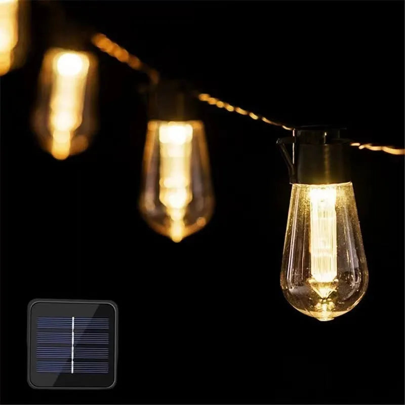 10 metre long retro infusion bottle shaped solar string lights draped outdoors with IP55 waterproof rating.