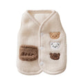 Brown fleece dog coat with bear embroidery and side-button closure on a small dog