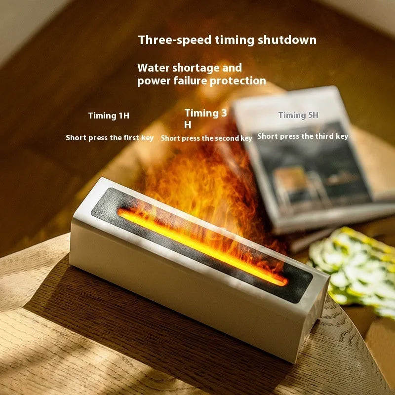 Square black USB aroma diffuser with colourful simulated flame light on a wooden table.