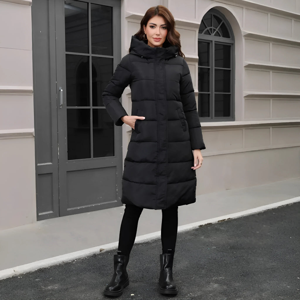 Black slim fit hooded long jacket on a model, showing tapered silhouette and regular sleeves