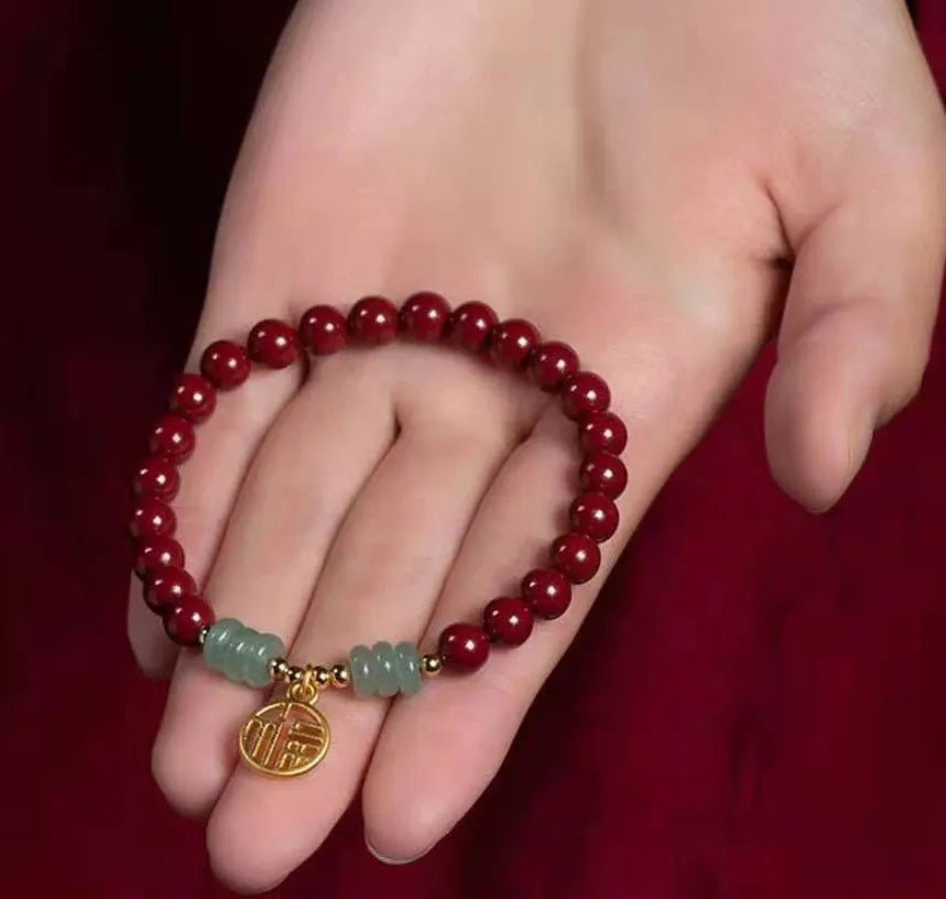 Traditional handmade gold cinnabar wave bracelet with copper bead accents in pumpkin or brand cinnabar colour options
