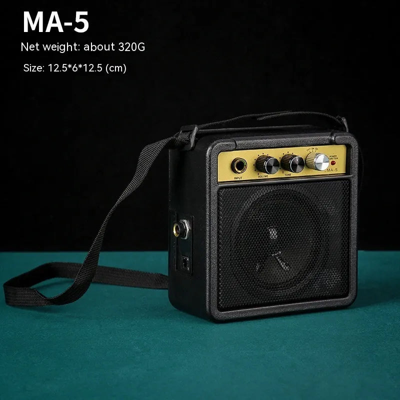GA-10 portable guitar amplifier with 10W output, metal plastic finish, 25x8x26cm size