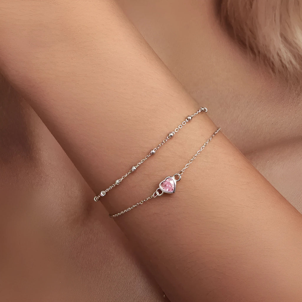 Sweet girlish 925 sterling silver bracelet with small heart-shaped pendant on an adjustable chain.
