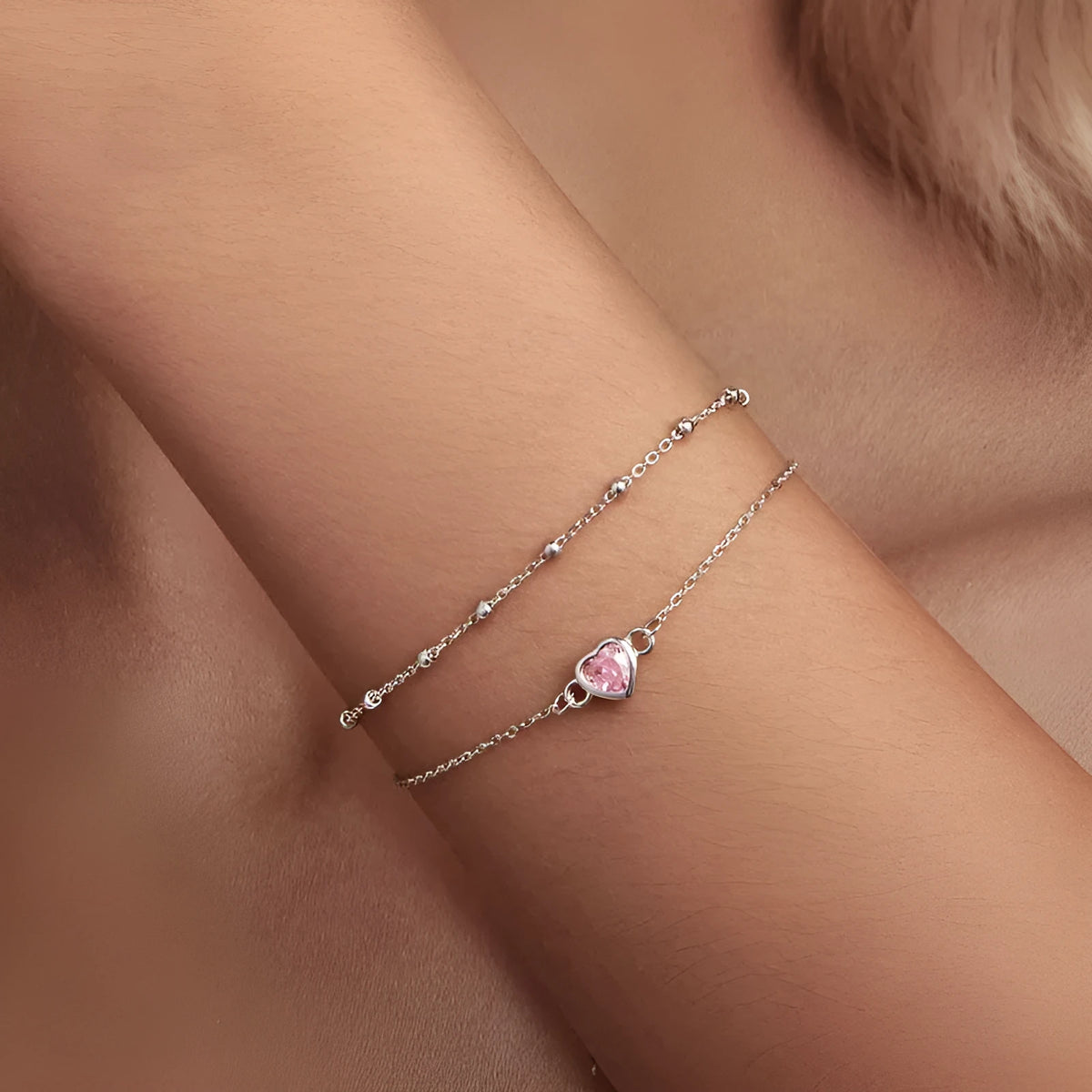 Sweet girlish 925 sterling silver bracelet with small heart-shaped pendant on an adjustable chain.
