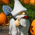 Smoking shovel dwarf Christmas garden ornament made from coloured resin and plastic materials