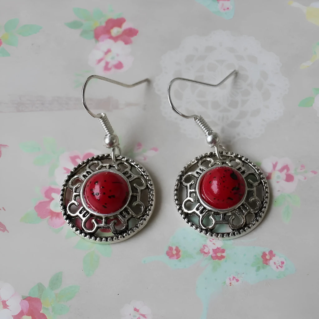 Handmade Miao silver retro earrings with turquoise inlay and geometric flower disk design