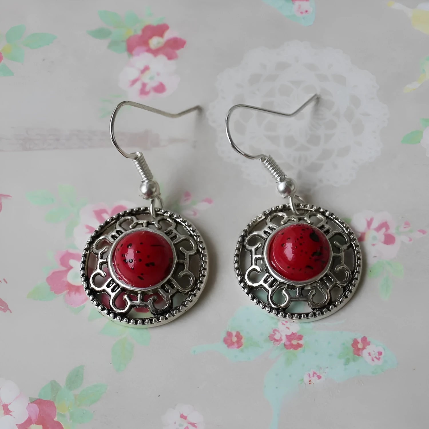 Handmade Miao silver retro earrings with turquoise inlay and geometric flower disk design