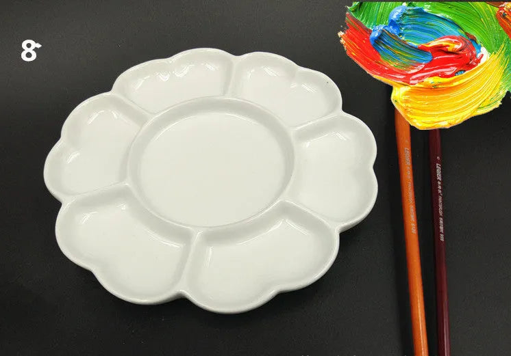 White handmade ceramic plum blossom shaped artist palette for painting.