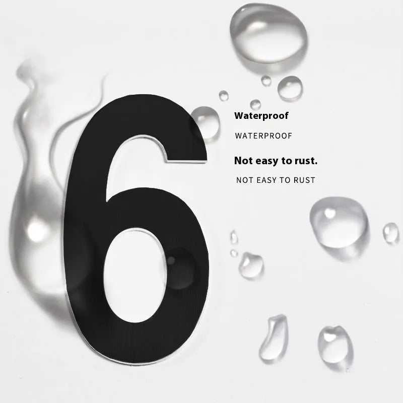 Black stainless steel house number with self-adhesive backing measuring 7.5cm