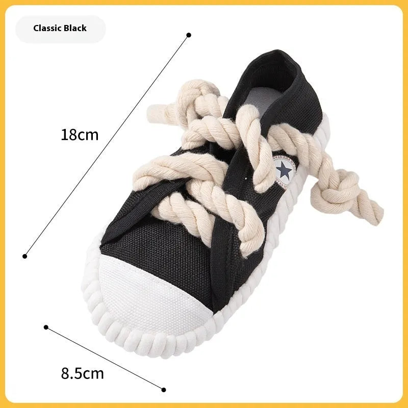 Squeaker dog chew toy shaped like slippers in plastic with bends for dental cleaning