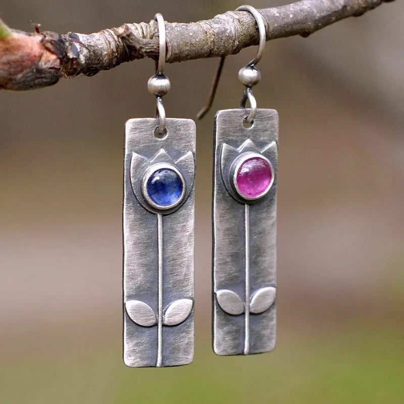 Antique finish red sapphire geometric earrings with elliptical stones and retro styling