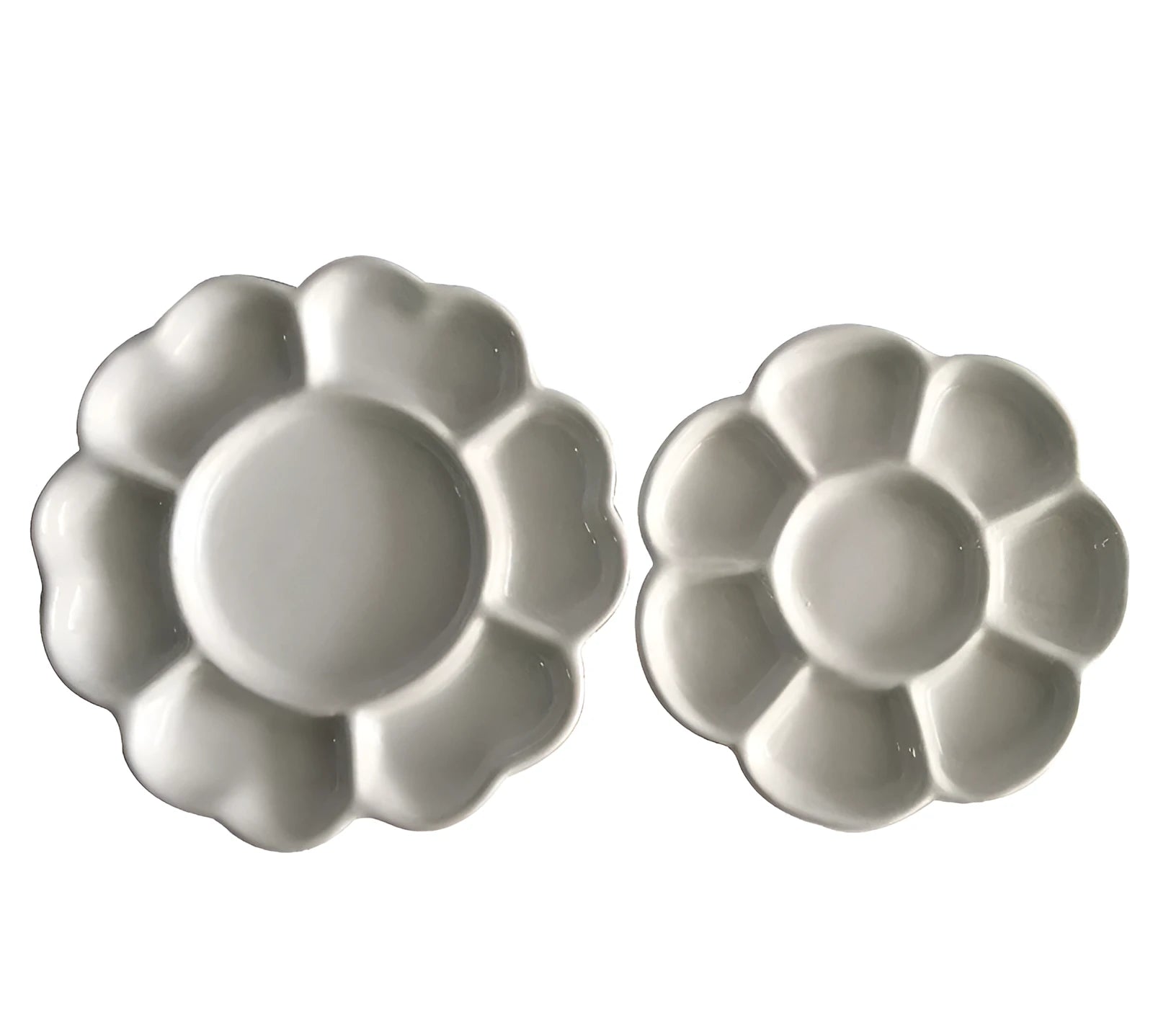 White handmade ceramic plum blossom shaped artist palette for painting.
