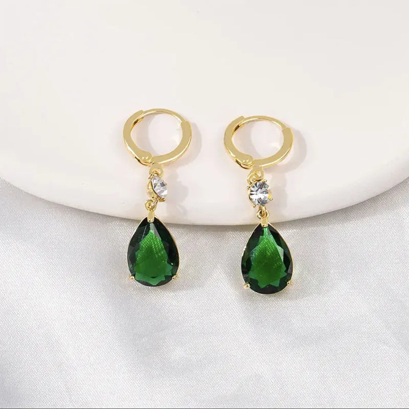 A pair of green geometric teardrop-shaped alloy earrings.