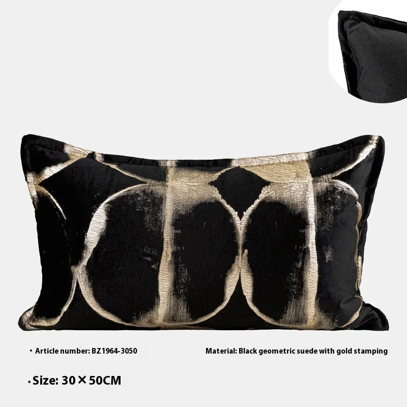 Black and gold abstract pattern cushion with flannel cover on a grey sofa