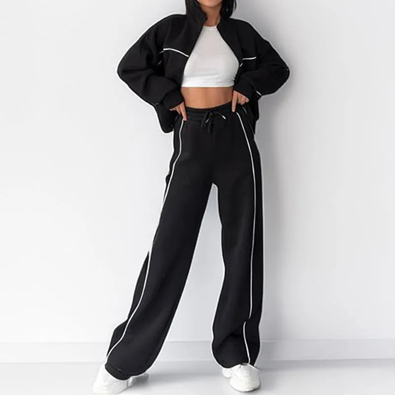 Casual striped suit set comprising a long sleeve mock neck hoodie and matching lace-up trousers.