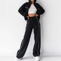 Casual striped suit set comprising a long sleeve mock neck hoodie and matching lace-up trousers.