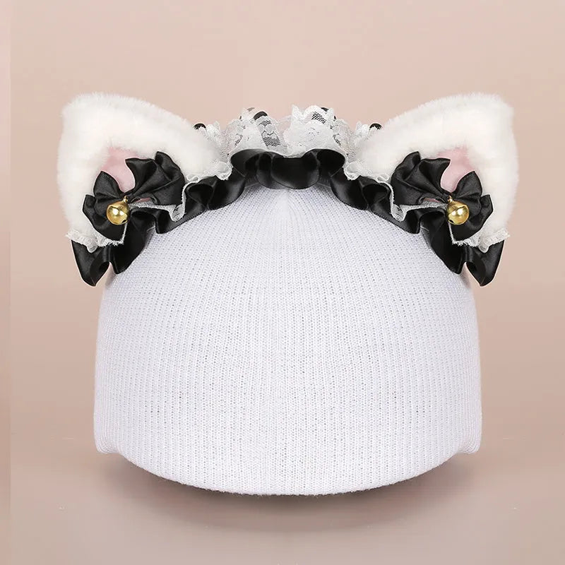 Plush fabric ski helmet decoration hat featuring a colourful cartoon design, shown on a helmet.