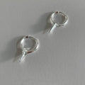 Women's platinum-coloured geometric star ear clips with a white gold plated finish.
