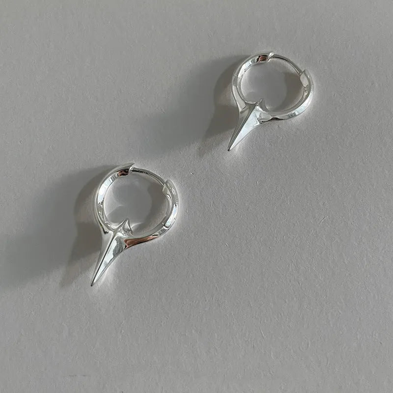 Women's platinum-coloured geometric star ear clips with a white gold plated finish.