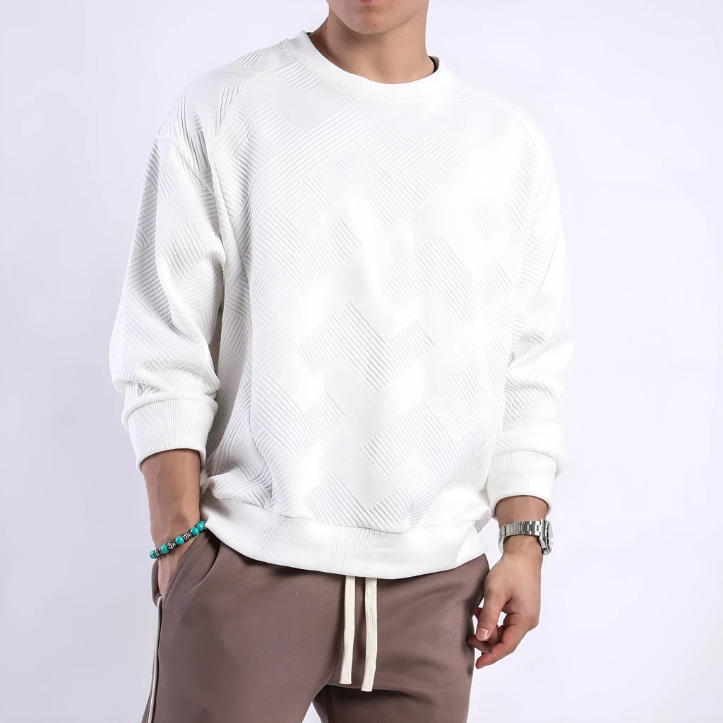 Man wearing a loose fit Army Green long sleeve twill jacquard pullover sweater.