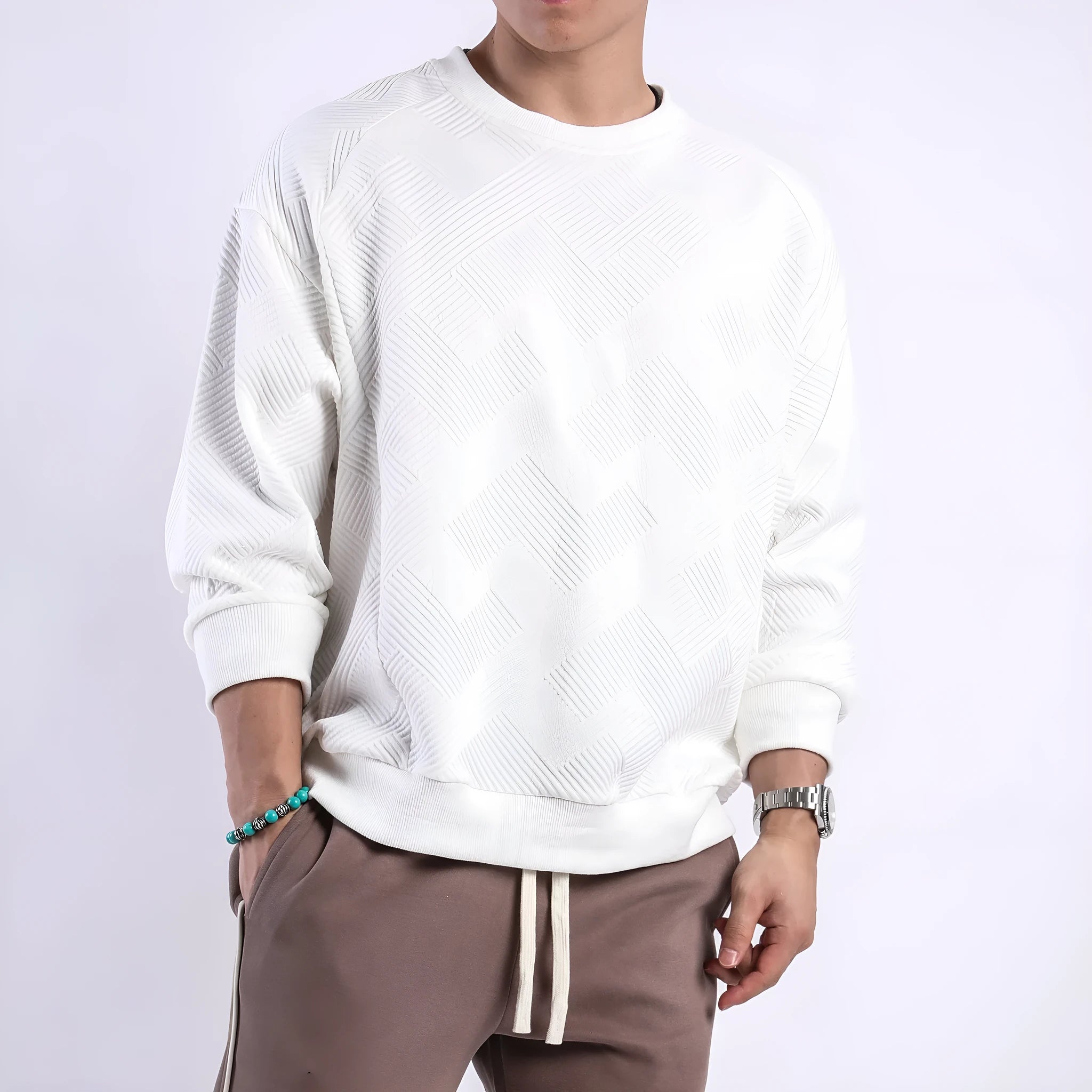 Man wearing a loose fit Army Green long sleeve twill jacquard pullover sweater.